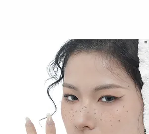 Close-up of minimalist silver ring on finger showing unique tinfoil texture and freckle makeup