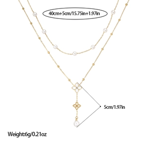 Collier double couche en perles dorées avec pendentif fleur évidée et pompon cœur