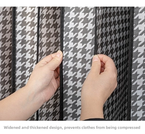 Close-up of thickened houndstooth fabric garment cover showing widened side gusset details