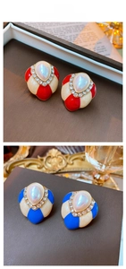 Detail showing vintage heart enamel earrings with teardrop pearls and crystals