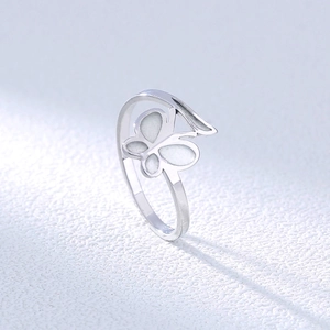 Detailed side view of silver stainless steel ring featuring an open butterfly design