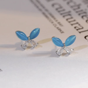 925 silver butterfly earrings with blue opal and zircon wings in a sleek minimalist style