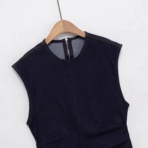 Dark blue denim sleeveless dress with round neck and detailed stitching on white background