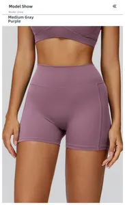 Detail view of high-waist yoga shorts in grey-purple with ruched tummy control design