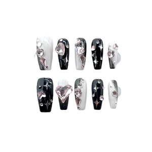 Handmade black and white press-on nails set with large 3D rhinestones and star glitters
