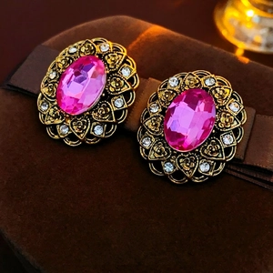 Vintage Baroque earrings with oval pink gemstones and golden filigree accents