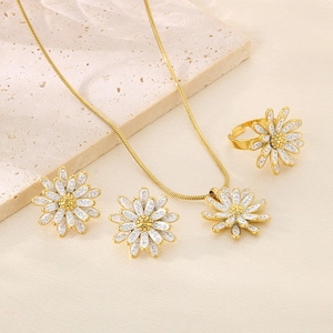 Elegant stainless steel daisy jewelry set with white enamel petals and gold finish