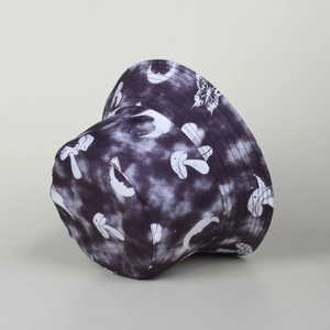Detailed view of tie-dye bucket hat with mushroom and butterfly print patterns