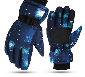 Detail of blue starry pattern ski gloves showing anti-slip palm and adjustable wrist strap