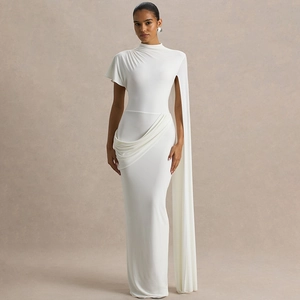Detail of elegant white bodycon dress featuring a draped cape sleeve and ruched waist details