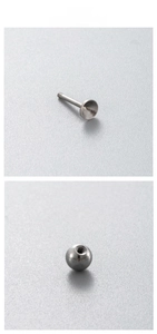 Detailed view of F136 titanium threaded screw ball and ear stud piercing base components