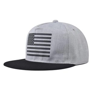 Close-up of snapback hat featuring grey crown with black brim and USA flag embroidery