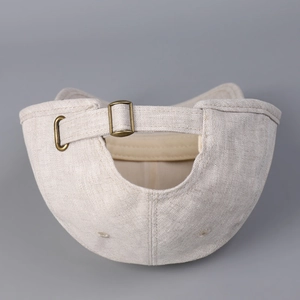 Detail view of cotton linen baseball cap back with vintage metal adjustment buckle