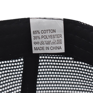 Detail of baseball cap care label showing 65% cotton and 35% polyester fabric composition