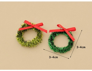 Miniature Christmas wreaths with red bows showing 3-4cm diameter size measurements