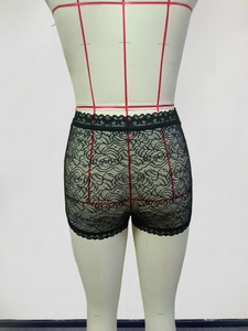 Detailed back view of black floral lace boy short panties with scalloped edges