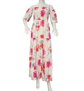 Detail of off-shoulder floral maxi dress featuring smocked bodice and puff sleeves