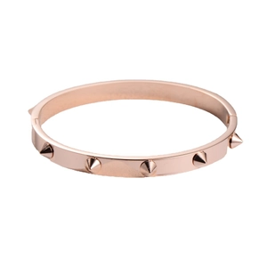 Polished rose gold stainless steel studded bangle with sharp conical rivets