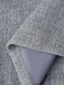 Macro shot of grey wool fabric texture and smooth inner lining for women coat