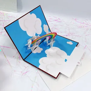 Detailed 3D pop-up card featuring a vibrant rainbow and clouds with a pull-out note