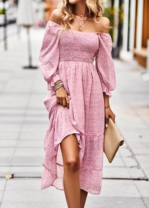 Detail of pink floral off-shoulder dress with smocked bodice and layered ruffle hem
