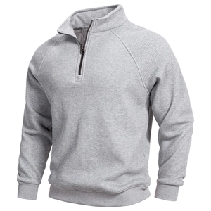 Detail of grey quarter-zip sweatshirt showing ribbed texture and stand-up collar design