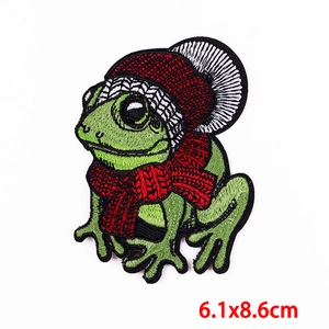 Detailed view of frog embroidery patch with winter hat and scarf, size 6.1x8.6cm