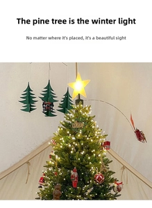 Glow yellow star topper on decorated Christmas tree with various ornaments and ornaments