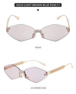 Close-up of geometric rimless sunglasses with sparkling rhinestones and gold metal arms