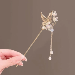 Detail view of gold butterfly hair stick with pearls and long tassel for Hanfu styling