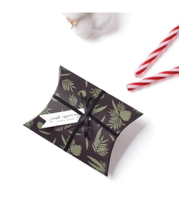 Mini pillow gift box with green leaf pattern, black ribbon bow, and gift tag
