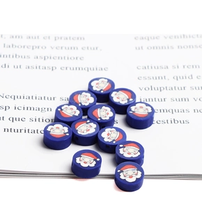 Macro shot of blue cylinder Santa Claus polymer clay beads for DIY jewelry making