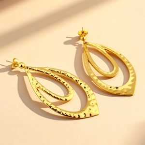 Fashionable gold-tone double-layered teardrop earrings with a unique hammered texture