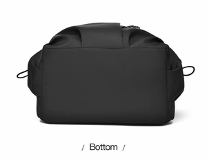 Flat bottom view of a black nylon backpack showing smooth fabric texture and side drawstrings