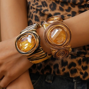 Statement twisted metal wire open bangle with vibrant yellow faceted crystal gemstone