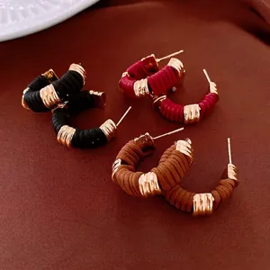 Vintage gold hoop earrings with intertwined faux leather in black, burgundy and brown