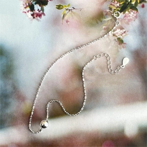 Detail of S925 sterling silver beaded anklet featuring a spring clasp and extension chain