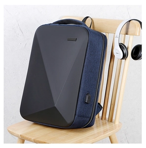 Detail view of business backpack with USB charging port and geometric hard shell panel