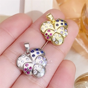 Copper heart pendant with colorful cubic zirconia stones in gold and silver finishes