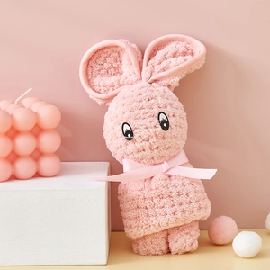 Pink coral fleece towel shaped like a rabbit with a Just For You decorative ribbon