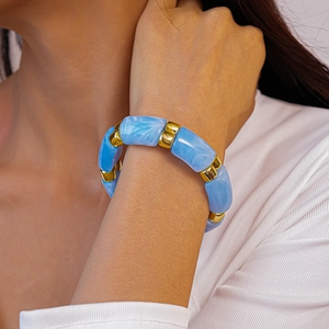 Close-up of blue marble resin beaded bracelet with gold square metal spacers