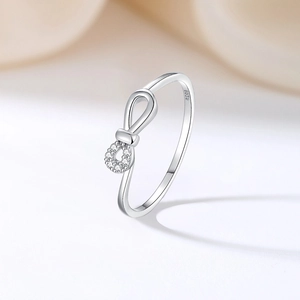 Elegant S925 sterling silver bow knot ring featuring infinity design and sparkling cubic zirconia