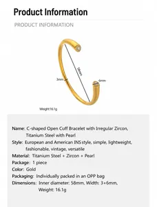 Detail of 18K gold-plated C-shaped stainless steel bracelet with pearls and zircons