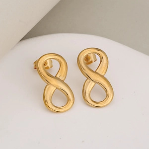 Gold infinity stud earrings in brushed stainless steel finish on a clean white display