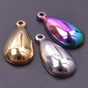 Detailed close-up of water drop pendants in gold silver and rainbow finishes