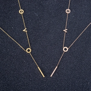 Gold and rose gold titanium Y-shaped LOVE necklace with screw motif ring pendants