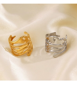Irregular lava design open rings in gold and silver finish on silk background