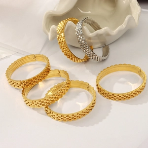 Chic layered gold and silver chain link bracelets with granular metal texture
