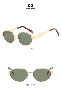 Oval gold metal frame sunglasses with dark green lenses and tortoiseshell temple tips