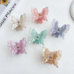 Detailed set of six pearlescent butterfly hair claws in various macaron colors